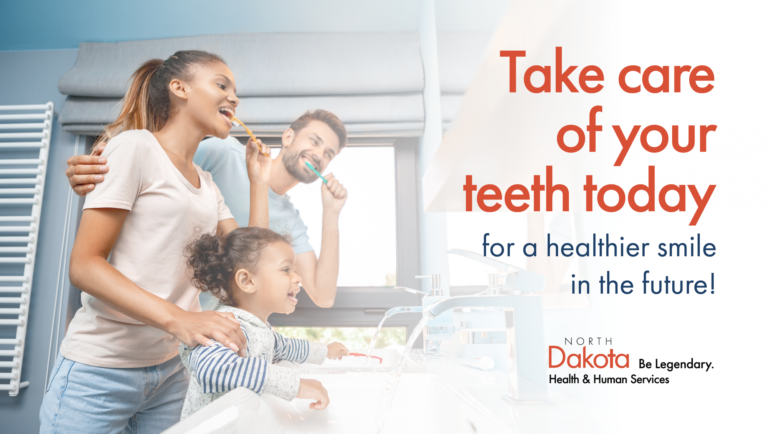 Man and woman brushing their teeth and smiling.