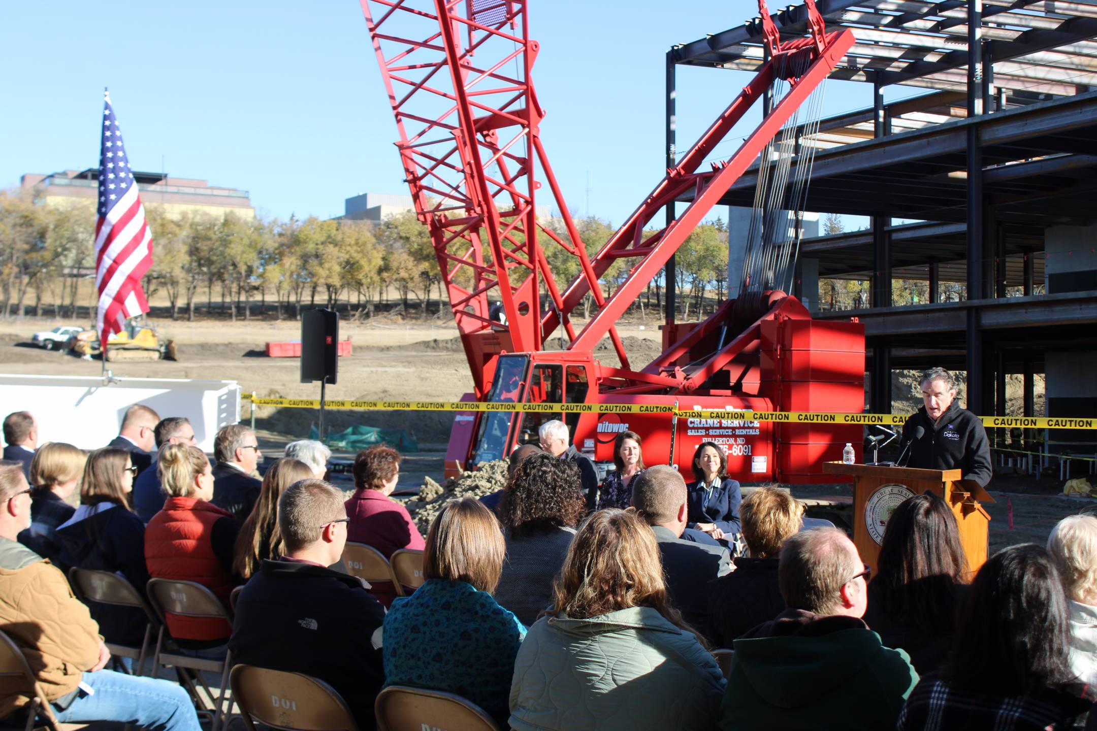 Governor Burgum addresses the crowd at the beam signing ceremony