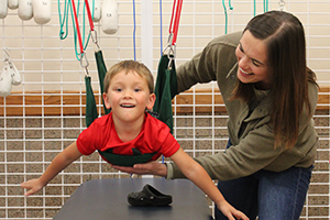 Image of child on exercise mat for therapy