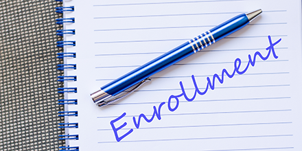 enrollment written on paper