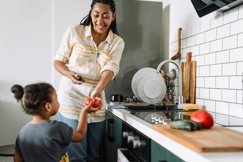 Mom and daughter washing food