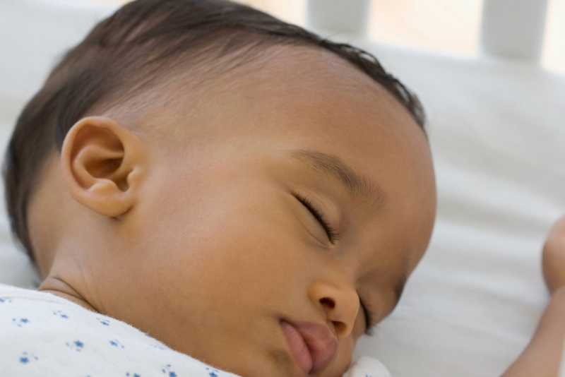 Baby sleeping in a crib